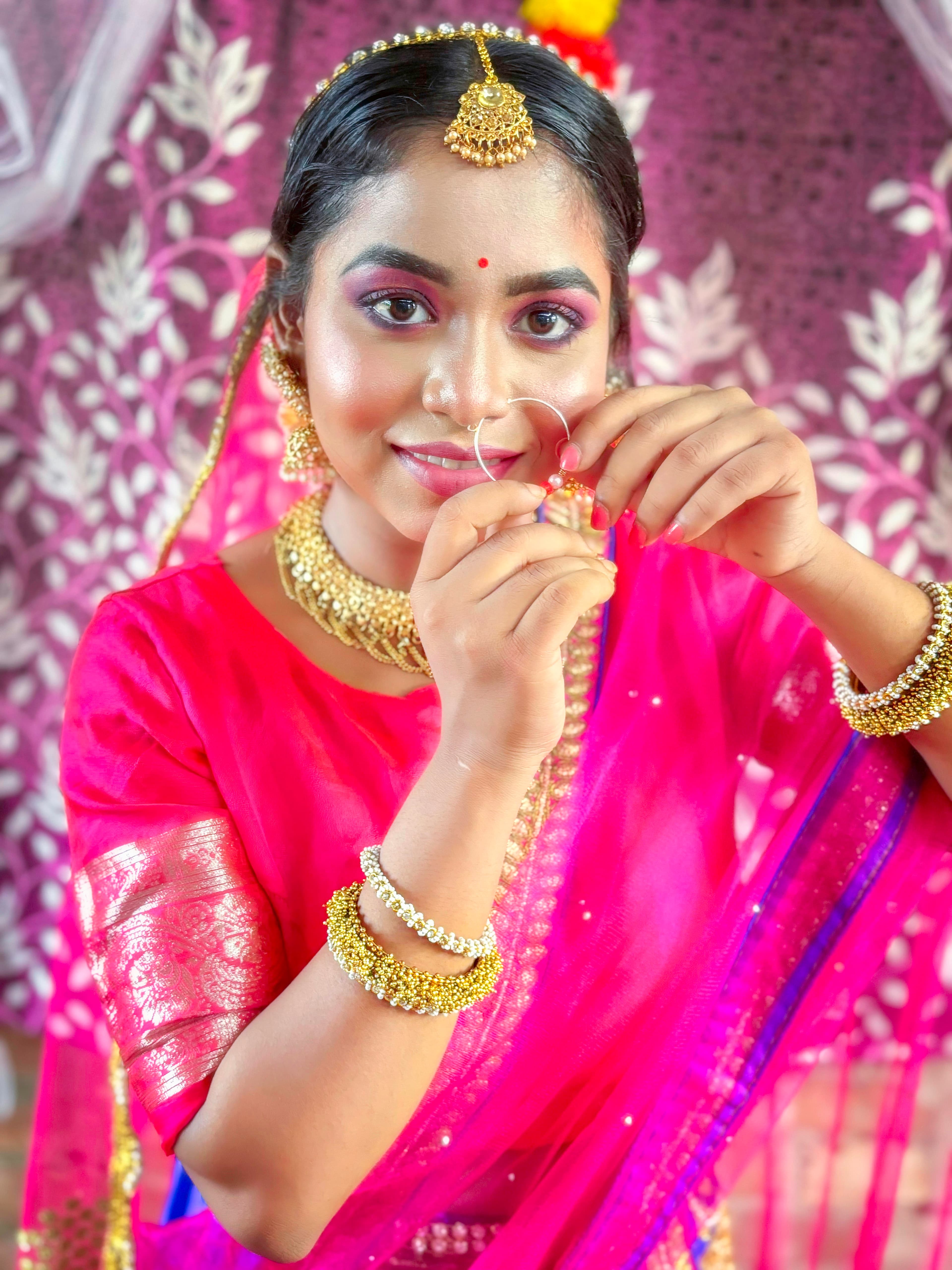 Bride adorned in traditional Indian bridal jewellery